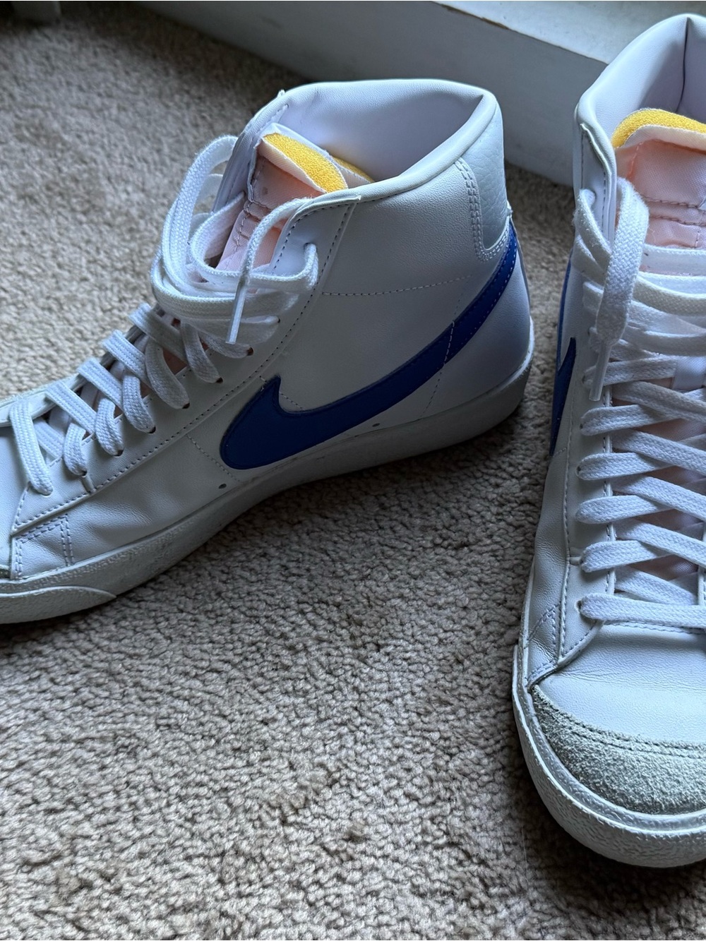 Nike Men’s White High-Top Sneakers with Blue Swoosh and Yellow Tongue